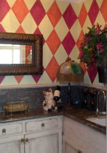 Painted Harlequin pattern with crackle finish on cabinetry.