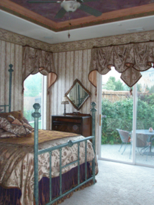Custom-designed bedroom: faux painted ceiling, window treatments, wall paper, bed & bedding.