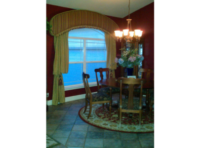 Tuscan Style Dining Room: Arched Cornice w/trim and area rug from Peru.