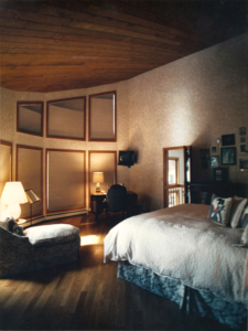 Customer desired bed designed to emulate Actress Winona Rider's bed as seen in Architect Digest magazine May 1994. Faux painted walls, chaise upholstered to coordinate with bed.