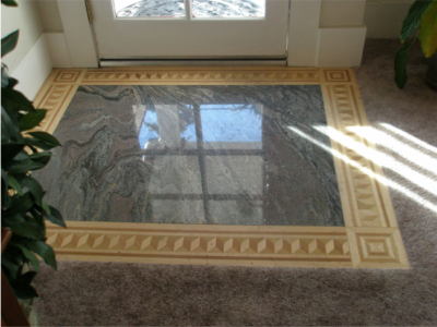 Entry Floor: Granite Slab with Inlaid Wood.