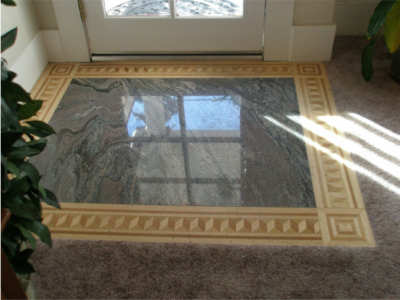 Entry Floor: Granite Slab with Inlaid Wood.