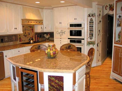 View 1: Handmade Topiary Tiles, Granite Counters, Custom Island w/ wine cooler, Painted Cabinets, Wood Floor, Tile Stove Mural and hood.