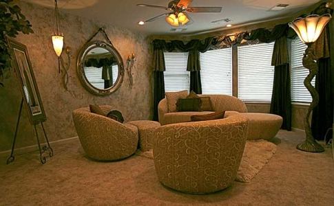 Contemporary custom made silk furniture and rug area. Murano glass hanging lamp from Italy and fabric draped sculptured Torchiere Lamp. Faux painted walls and custom made window treatments with glass beads.