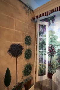 Painted Stone Wall & Topiaries.