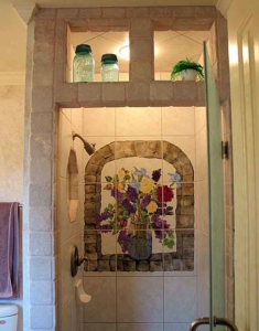 Custom shower with a hand-painted tile mural.
