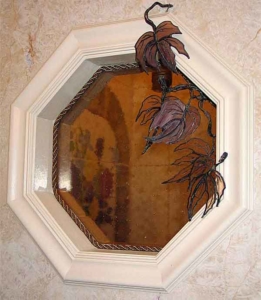 Octagonal window built into shower; custom vine accessory.